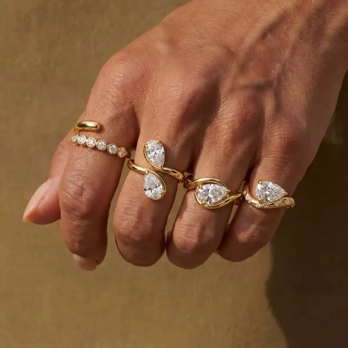 Gold fashion rings with pear-cut stones, photographed for JY Jewellery.